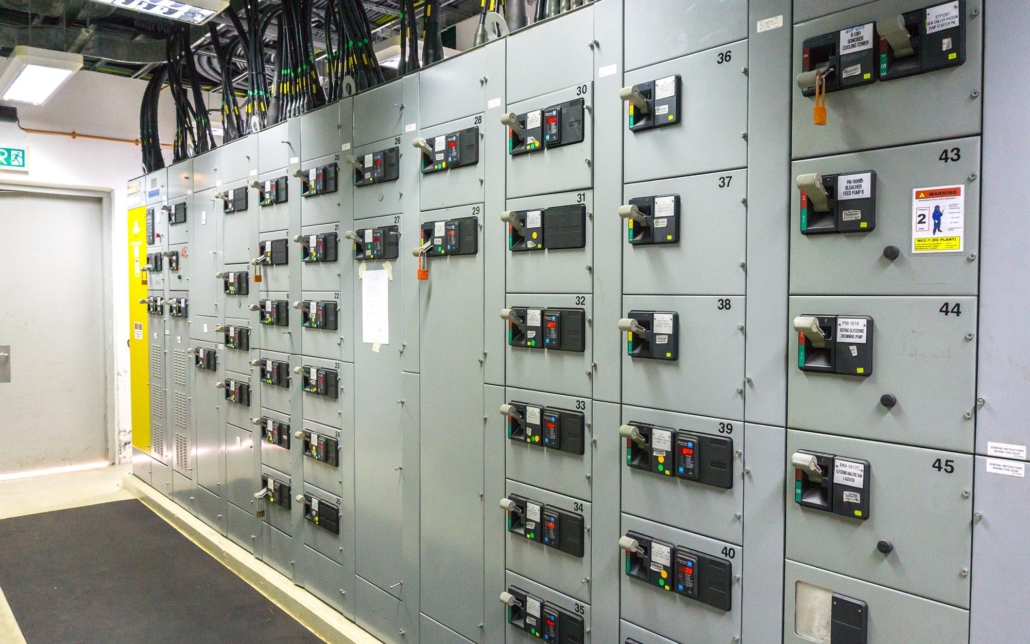 Large electrical control room with various switches