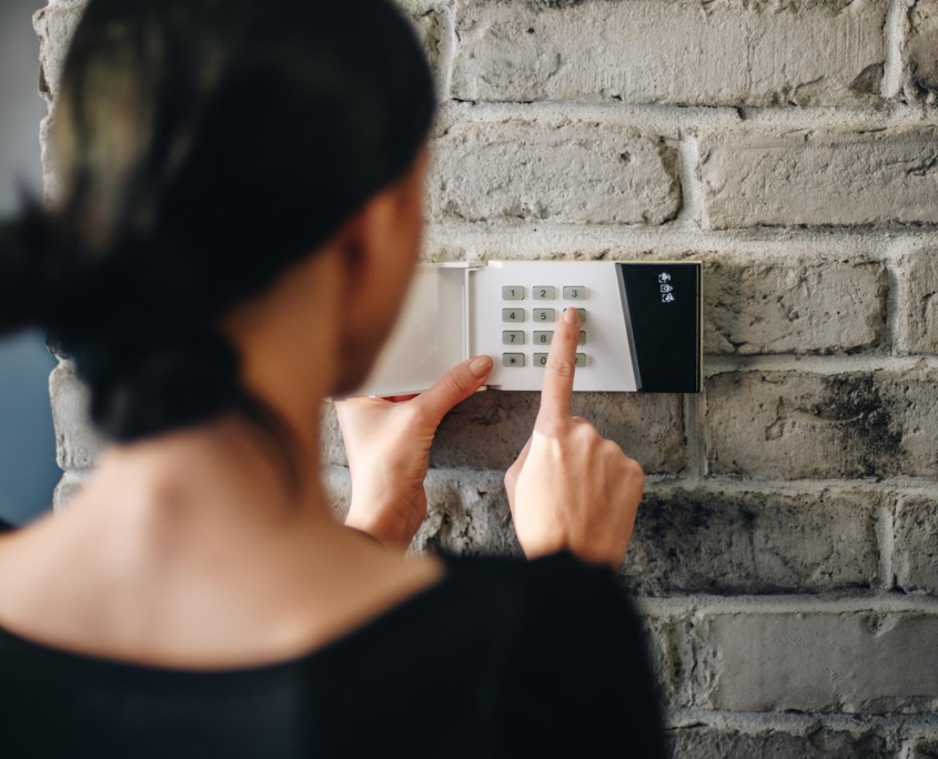 View of a person setting up an alarm system