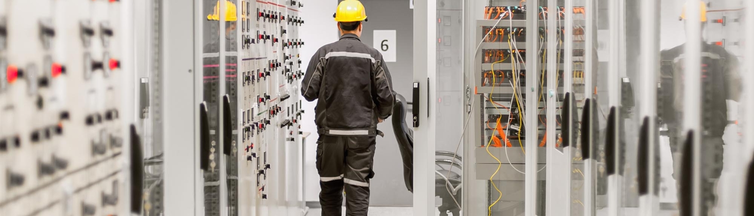 Worker in electrical room