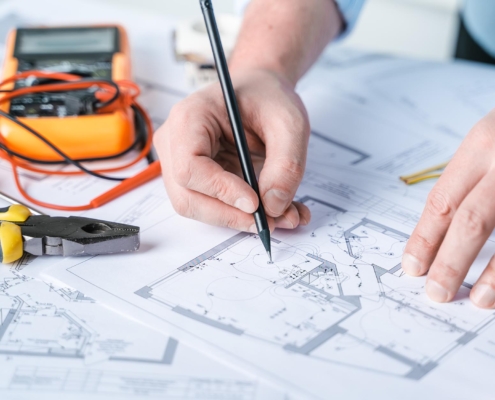 Engineer working on electrical plan for building