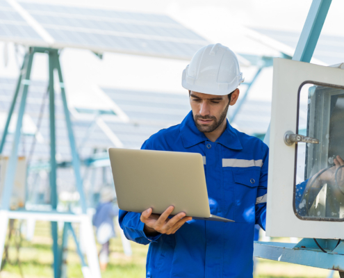Professional electriciian working on electrical box