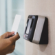 Proximity card door unlock, Hand security man using ID card on fingerprint scan reader